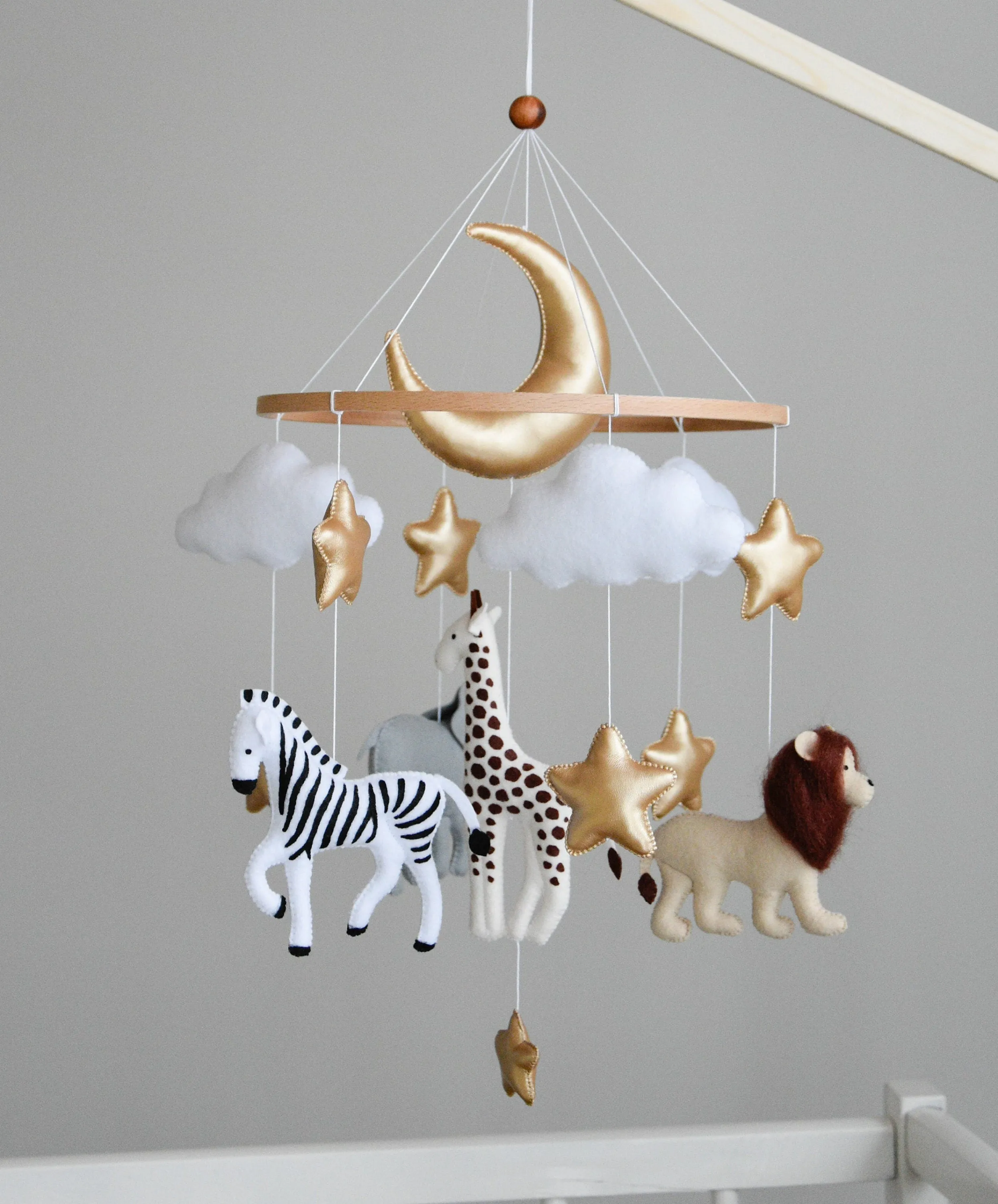 Safari mobile with giraffe, lion, elephant, moon, stars and clouds