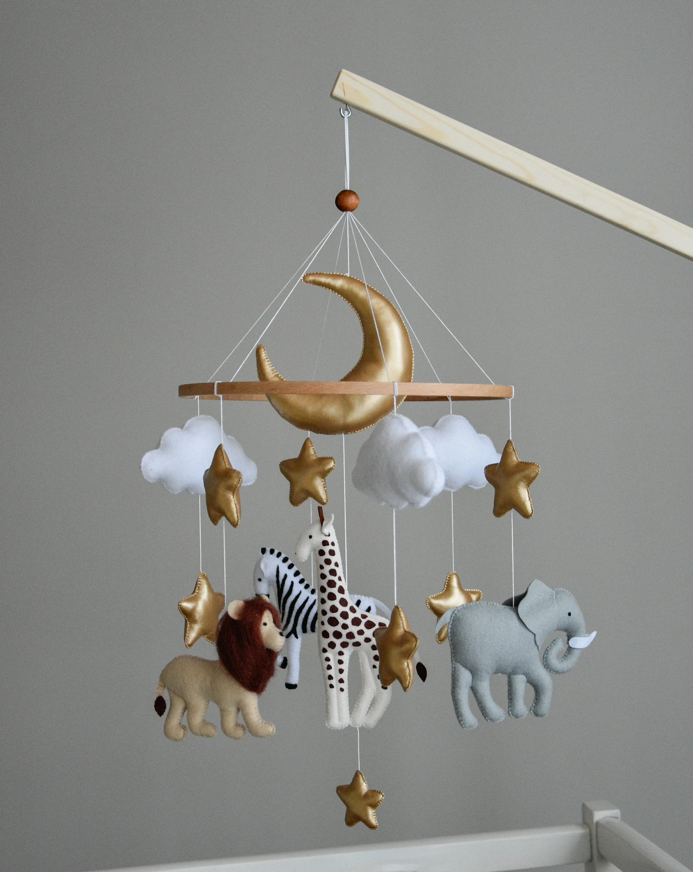 Safari mobile with giraffe, lion, elephant, moon, stars and clouds